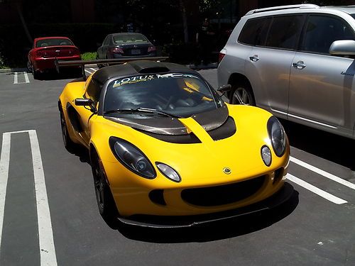 2006 solar yellow exige with katana sc, carbon roof, wing etc.