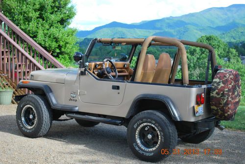 Awesome one of a kind wrangler with four inch lift, new tires and wheels.