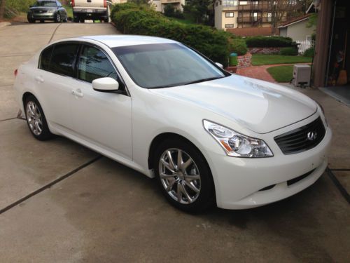 2009 infiniti g37 sedan, 25,000 miles, 6 speed manual transmission.