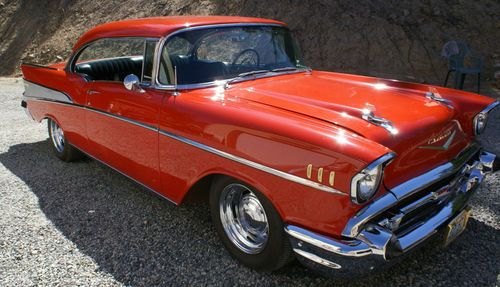 57" chevy 2 door bel air, matador red w/ black interior