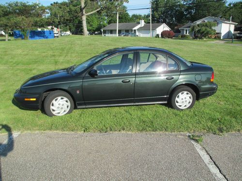 1999 saturn sl2 green sedan 4-door 1.9l twin cam, over 34mpg. automatic