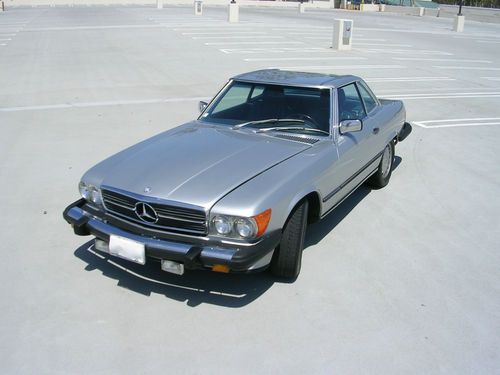 1986 mercedes benz 560 sl, silver with blue soft top and interior