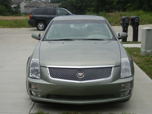 Sts cadillac (silver green color rare) keyless entry, and remote start, bose.