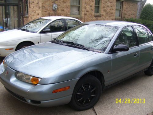 2002 saturn sl silver blue special 4 door with a/c. one owner,only 116,850 miles