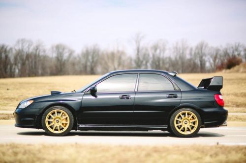 2006 subaru sti stage 2 ultra nice low 53k miles gold bbs very fast must see car