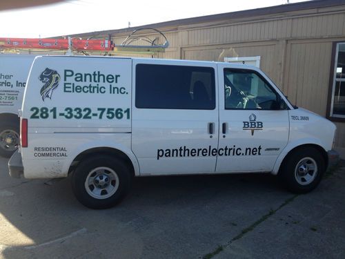 Chevrolet astro van, white company vehicle.