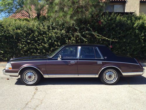 Super low mileage southern california garage kept beauty!  black/dark cabernet!