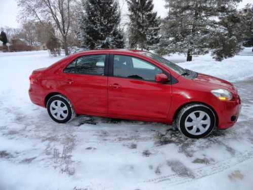 2008 toyota yaris  8,800 miles  base sedan 4-door 1.5l,  metalic red