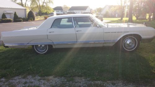 65 buick electra 225 4 door sedan, beige, good condition, runs well, clean