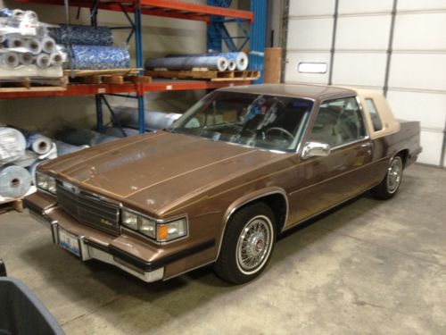 1985 cadillac coupe de ville, canyon brown w/ sandalwood cloth interior