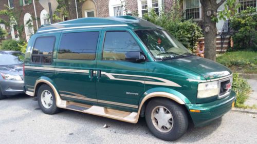Custom mini van, tv, electric bed, low miles, captains chairs and more