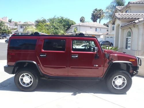 2003 red interior hummer h2 with adventure package