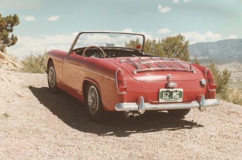 Restored &#039;62 mg midget, red with removable top and side curtains, good shape!