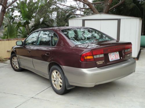 Burgandy subaru outback limited, 2000