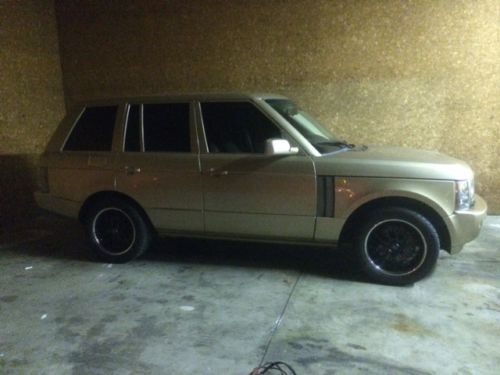 **** 2004 gold range rover w/2 sets of rims ****