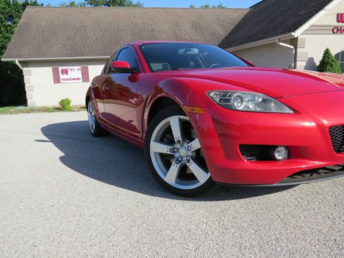 Near perfect.  beautiful candy apple red metal flake 6 speed 238 hp twin rotor.