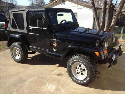 Sahara, automatic, 4.0l six cylinder, 2" lift, a/c, black demin top, 104k miles