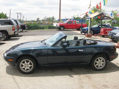 1997 mazda miata convertible.cold a/c good miles. runs perfect. no reserve...