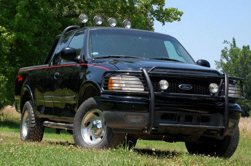 4 x 4 sport truck with kc and maxtel off road lights