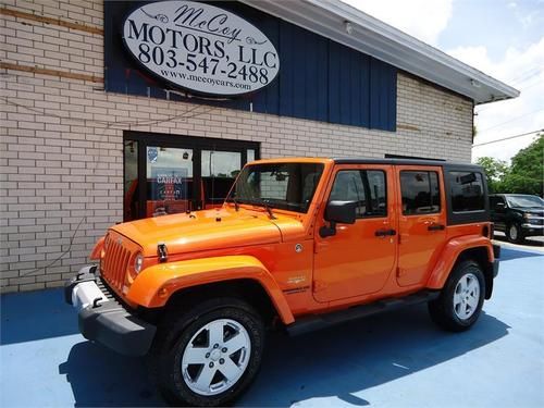 2012 jeep wrangler unlimited sahara sport utility 4-door 3.6l orange exterior