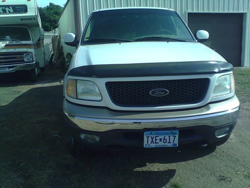 **look** ford f 150 extended cab flareside short box  with many extras!!!