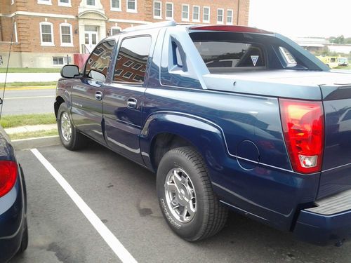 I am selling my 05 escalade ext 97,000 miles