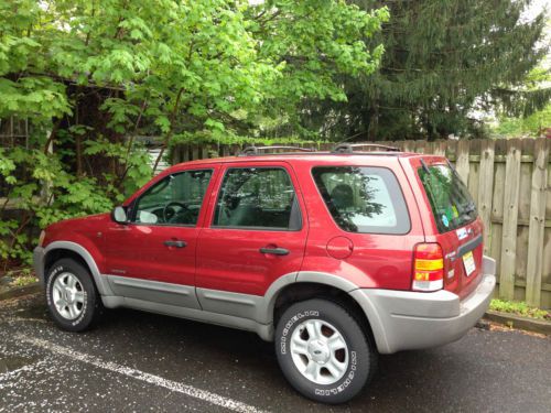 Red 2001 ford escape - good condition - as is