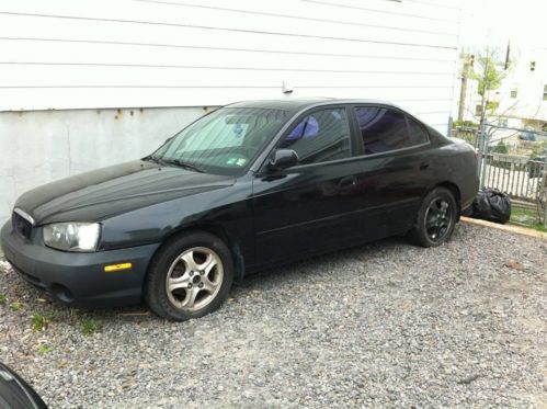 2001 black 4 door hyundai elantra with 132,000 miles on her