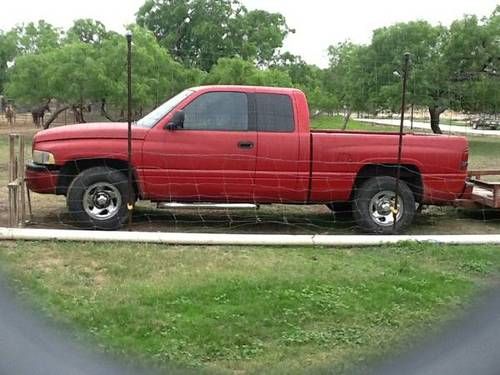 Red 2000 dodge half ton pick up king cab