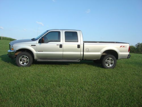 F-350, 4x4, diesel, crew cab lariat fx4 pkg, srw, custom wheels/tires, long bed