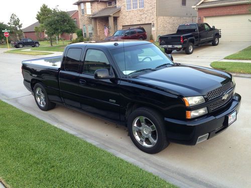 04 black silverado ss with bed cover