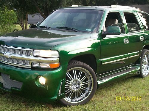 One of a kind like pimp my ride tricked out 02 tahoe with alligator interior