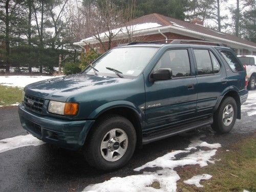 Honda suv rodeo 4 wheel drive good mpg perfect in &amp; out moonroof c/d cold a/c