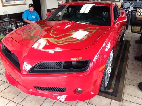 2012 chevrolet camaro with trans am body kit.