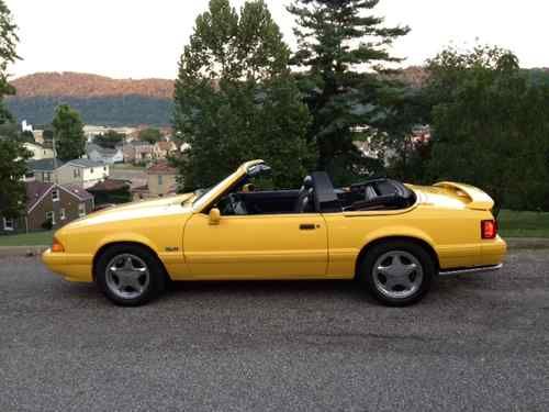 1993 lx  mustang one owner garage kept.yellow black top perfect condition,