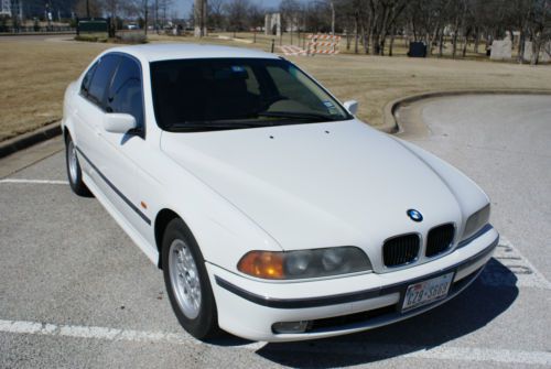 White ,low miles ,leather, hands free bluetooth,sirius ready