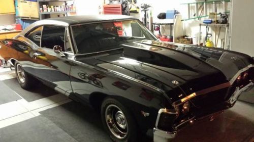 Black 2 door fastback in good condition with pristine 383 stroker motor