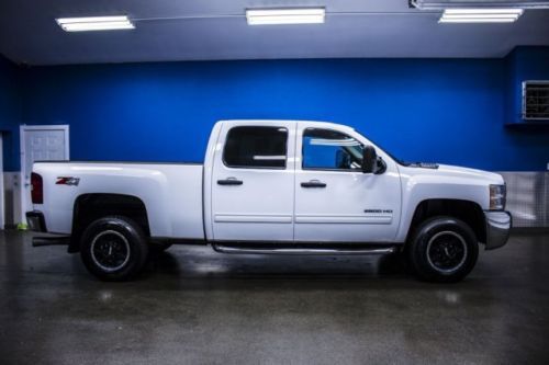 Low miles crew cab 6.6l duramax diesel nerf bars bed liner trailer hitch leather