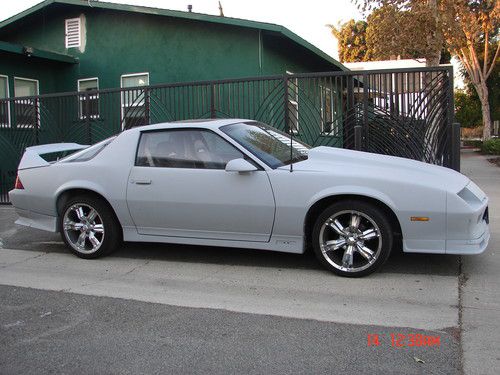 87 camaro coupe, 60k miles on a v6, 2.8 l, 173 cid rebuilt engine, one owner