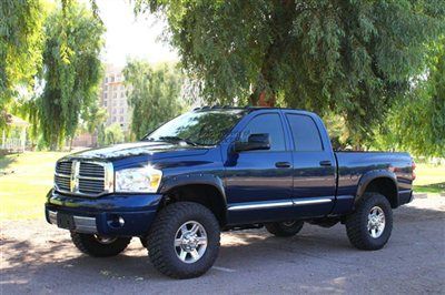 Leveled cummins diesel 4x4 bushwacker fender flares, leather, navigation