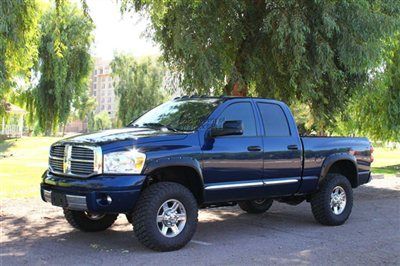 Leveled cummins diesel 4x4 bushwacker fender flares, leather, navigation