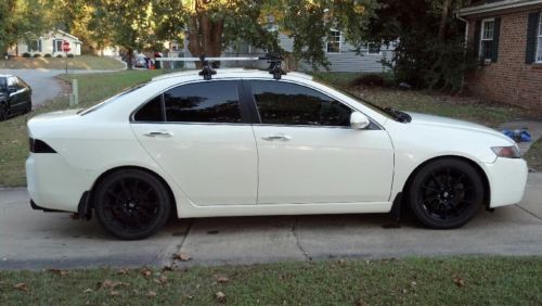 6 speed manual trans, custom lowered white sedan with black accents
