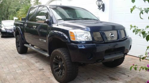 Lifted 5.6l v8 nissan titan crew cab 4-door chrome leather one owner cold air in