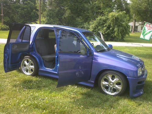 1999 chevy tracker utility 4-door 2.0l 4x4 low rider, suicide doors, shaved.