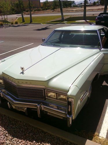 Classic 1977 eldorado cadillac in sea foam green with dark green leather roof