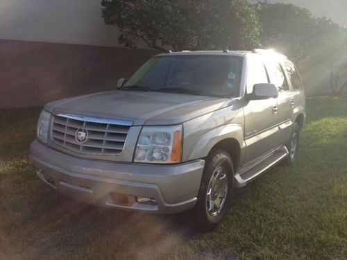 Cadillac escalade low miles save big