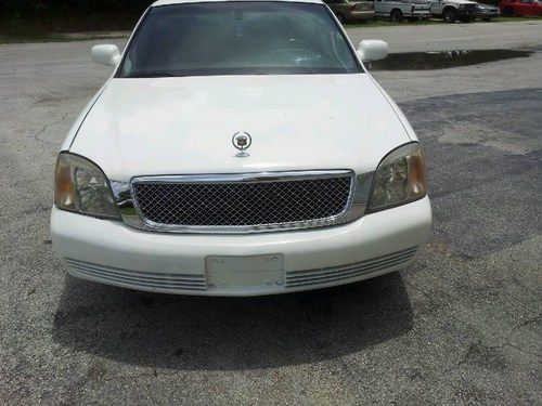 This is a 2001 cadillac deville limousine, purl white black interior clean!!