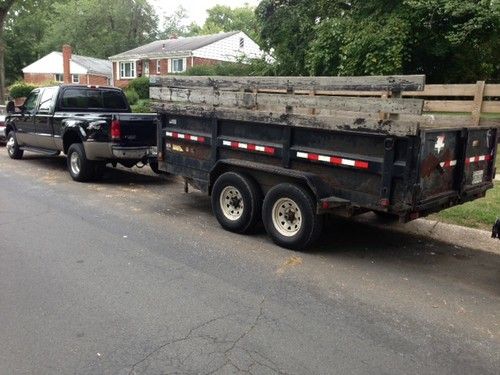 Good condition truck 4x4 ,lariat, black exterior,tan leather interior