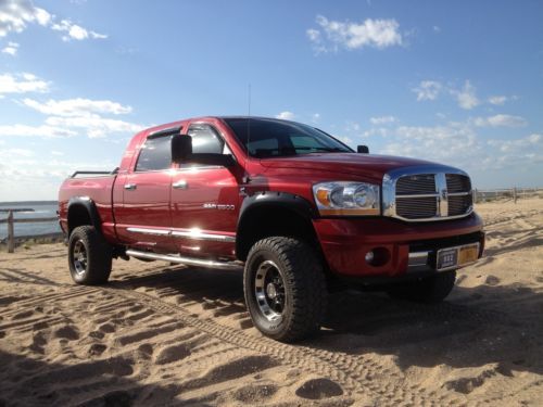 Mega cab slt laramie ( leather ) lifted! 5.9l diesel 4x4 low miles navigation