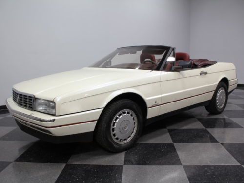 Georgeous pearl white finish, 4.1 liter v8, red leather interior, loaded, nice